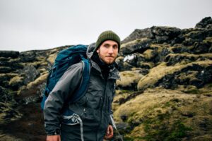 Adventure man walk in icelandic landscape alone
