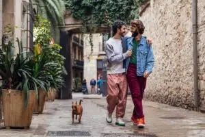 gay male couple walking with their dog